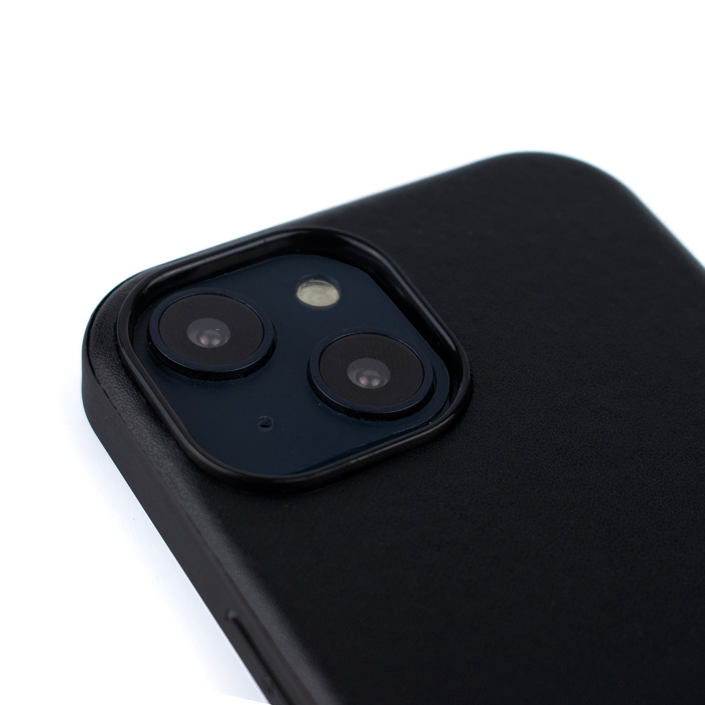 Back angled image of the SKNS LEATHER Black case fitted to the iPhone 14 & 15 Plus showing the raised lip and camera protection