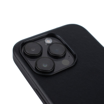 Angled close up picture of the SKNS LEATHER Black case for the iPhone 15 14 Pro Max highlighting the raised lip