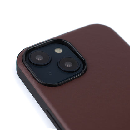 Back angled image of the SKNS LEATHER Brown case fitted to the iPhone 14 & 15 Plus showing the raised lip and camera protection