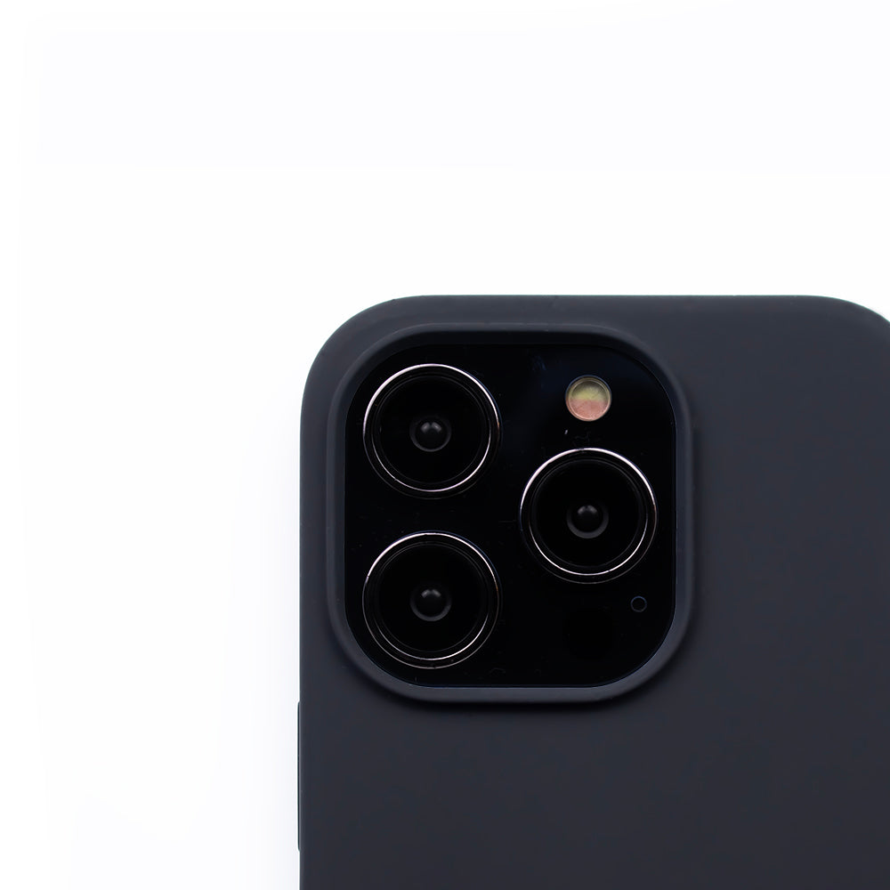 Close up image of the SKNS SILICONE case in black on the iPhone 14 Pro Max showcasing the cameras raised lip