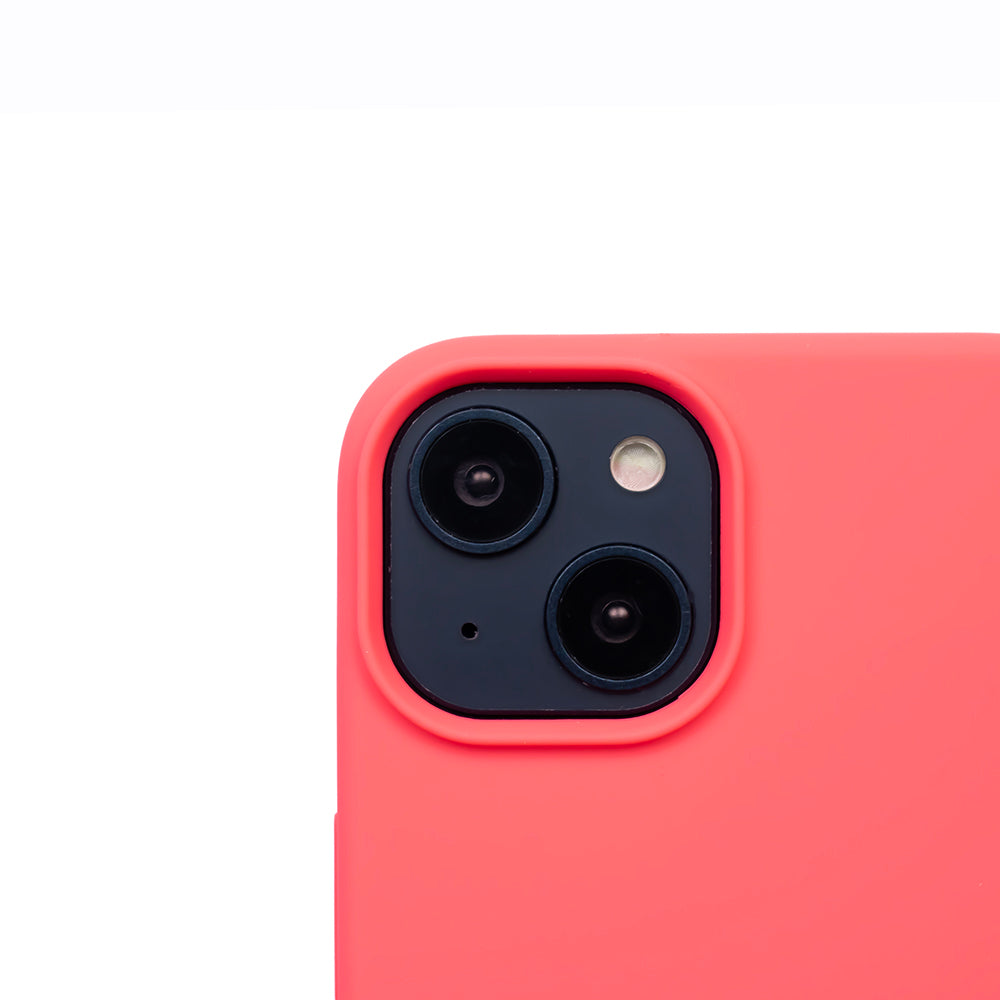 Close up image of the SKNS SILICONE case in Blood Orange on the iPhone 14 Plus showcasing the cameras raised lip