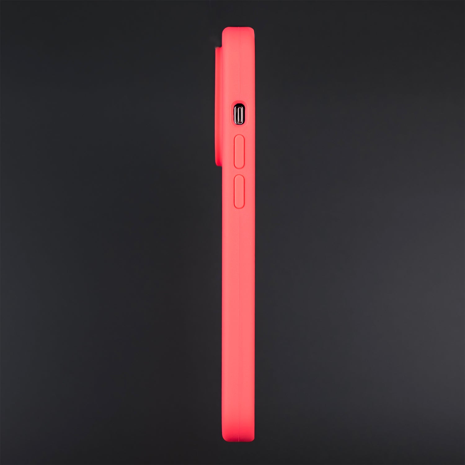 A side on image of the SKNS SILICONE Blood Orange case fitted to the iPhone 14 Pro Max, showing how slim and protective the case is