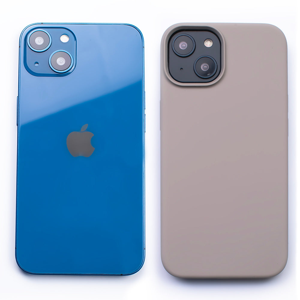 Side by side back image of the SKNS SILICONE Soft & Protective Slate Case fitted to the iPhone 14 Plus next to a plain iPhone highlighting the Protective slim design