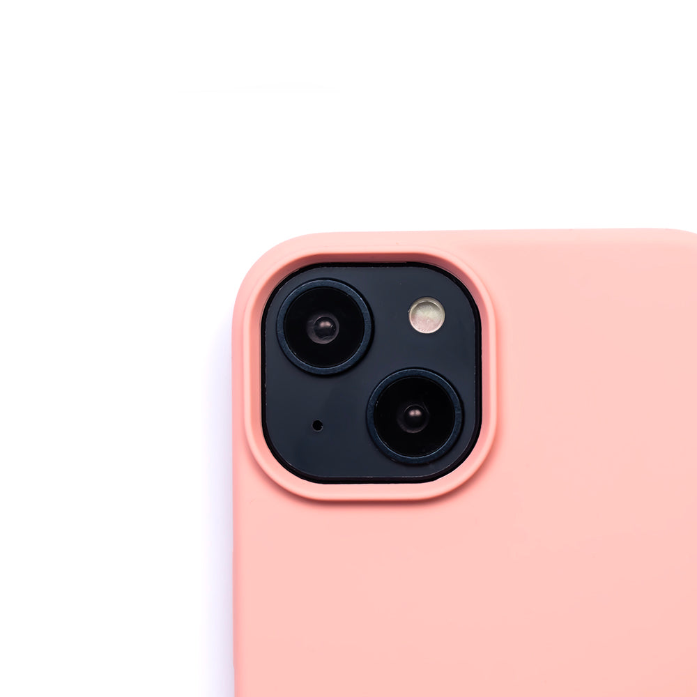 Close up image of the SKNS SILICONE case in Soft Pink on the iPhone 14 Plus showcasing the cameras raised lip