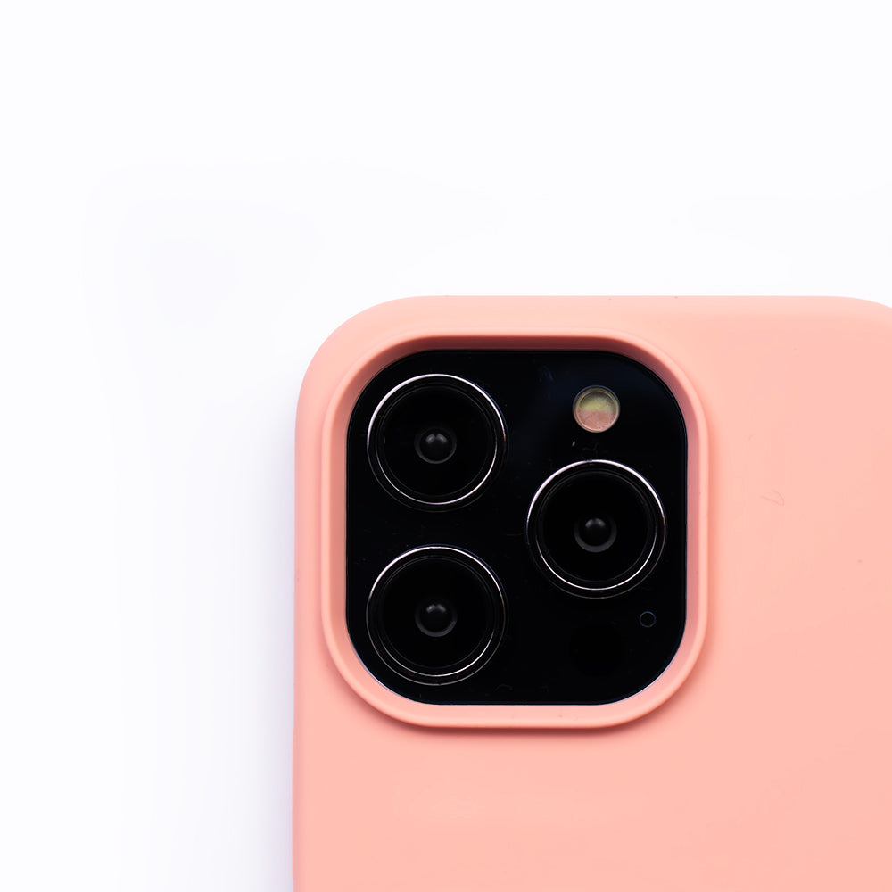 Close up image of the SKNS SILICONE case in Soft Pink on the iPhone 14 Pro Max showcasing the cameras raised lip