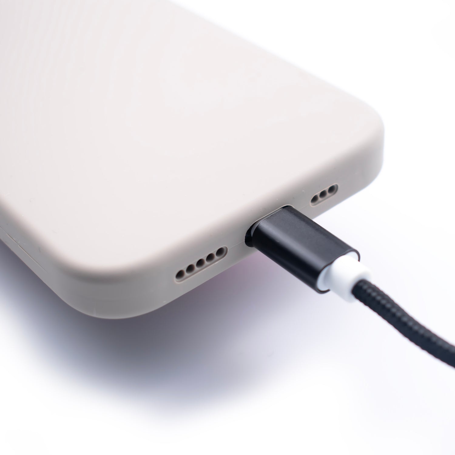 image showing the SKNS Lightning cable connected to a iPhone with the SKNS Silicone case fitted showing full compatibility with cases