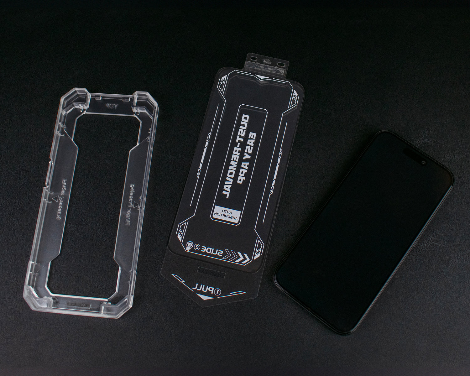 A deconstructed image of the SKNS Screen Protector and Guide tray along with an iPhone 15 Pro with the fitted protector